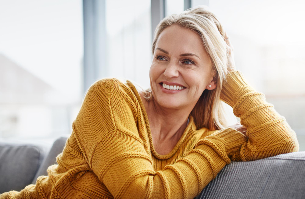 relaxing really lifts spirits shot attractive mature woman relaxing sofa home